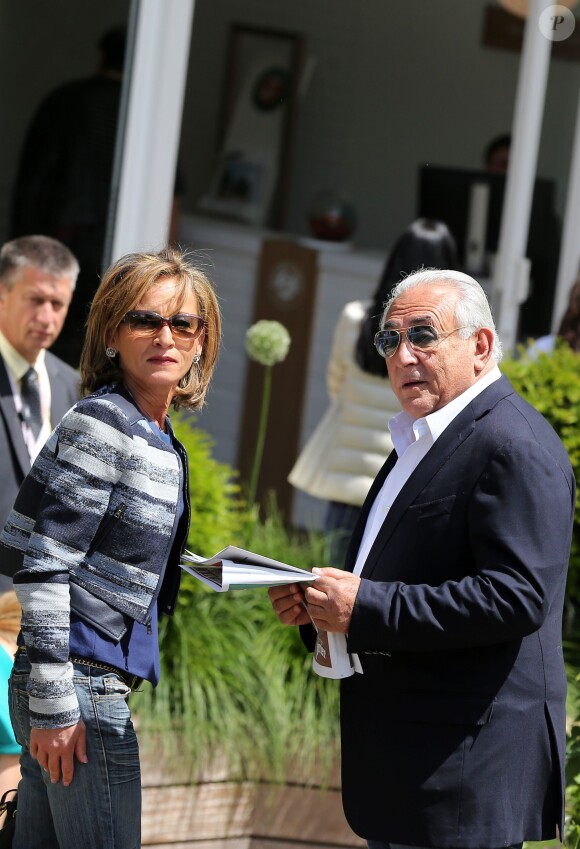Dominique Strauss Kahn et sa compagne Myriam L'Aouffir aux Internationaux de France de tennis de Roland Garros le 30 mai 2015.
