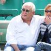 Dominique Strauss Kahn et sa compagne Myriam L'Aouffir dans les tribunes des Internationaux de France de tennis de Roland Garros le 30 mai 2015.