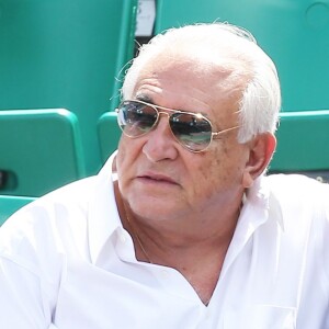 Dominique Strauss Kahn et sa compagne Myriam L'Aouffir dans les tribunes des Internationaux de France de tennis de Roland Garros le 30 mai 2015.