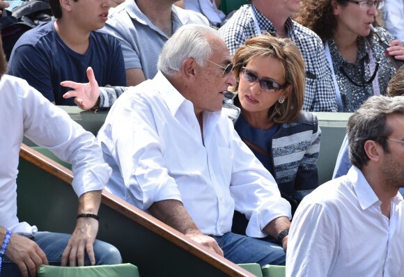 Dominique Strauss Kahn et sa compagne Myriam L'Aouffir - People dans les tribunes des Internationaux de France de tennis de Roland Garros le 30 mai 2015.