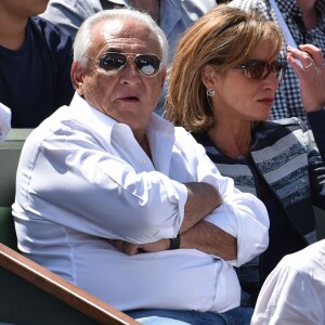 Dominique Strauss Kahn et sa compagne Myriam L'Aouffir - People dans les tribunes des Internationaux de France de tennis de Roland Garros le 30 mai 2015.