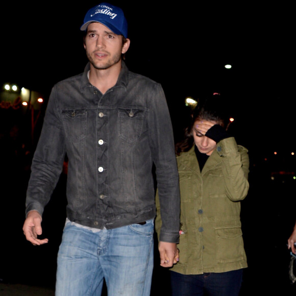 Ashton Kutcher et sa femme Mila Kunis arrivent au concert de Beyonce à Los Angeles, le 14 mai 2016