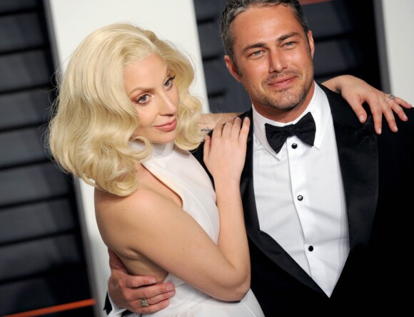 La chanteuse Lady Gaga et son compagnon Taylor Kinney - People à la soirée "Vanity Fair Oscar Party" après la 88e cérémonie des Oscars à Hollywood, le 28 février 2016.