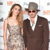 Johnny Depp et sa compagne Amber Heard (robe Elie Saab) à la Première du film "The Danish Girl" au festival International du film de Toronto (TIFF) le 12 septembre 2015