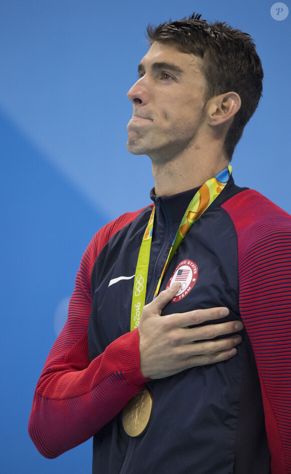 Michael Phelps en larmes après avoir gagné sa 22e médaille d'or à Rio de Janeiro, le 11 août 2016.