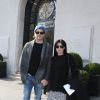 Exclusif - Shannen Doherty et son mari Kurt Iswarienko quittent l'hôtel de Sers à Paris le 18 mars 2016.