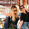 Kourtney Kardashian et Khloe Kardashian font du shopping et un tour de carrousel à Encino. Les 2 soeurs portent des chaussures avec de la fourrure noire, des sandales pour Kourtney et des claquettes pour Khloe! Le 23 août 2016