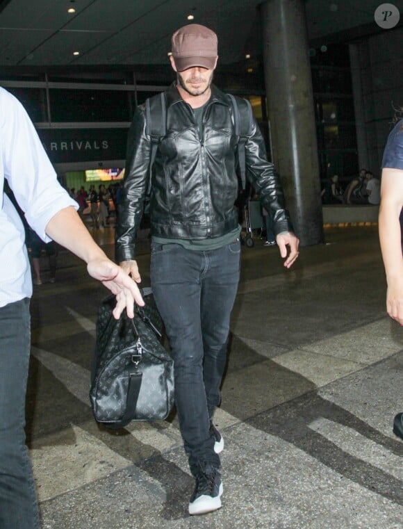 David Beckham arrive à l'aéroport Lax de Los Angeles le 24 juillet 2016.