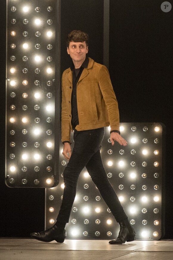 Designer Hedi Slimane appears on the runway at the end of the Saint Laurent Fall-Winter 2014/2015 men's collection presentation held at Musee des Invalides, in Paris, France, on January 19, 2014. Photo by Christophe Guibbaud/ABACAPRESS.COM20/01/2014 - Paris