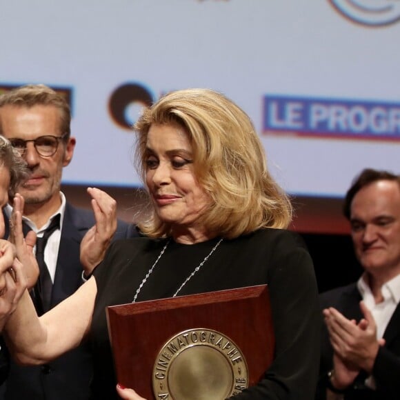 Roman Polanski, Bertrand Tavernier, Lambert Wilson et Catherine Deneuve lors de la remise du Prix Lumière 2016 à Catherine Deneuve durant le 8ème Festival Lumière à Lyon, le 14 octobre 2016