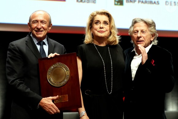Gérard Collomb, Catherine Deneuve et Roman Polanski lors de la remise du Prix Lumière 2016 à Catherine Deneuve durant le 8ème Festival Lumière à Lyon, le 14 octobre 2016