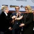 Roman Polanski, Lambert Wilson et Catherine Deneuve lors de la remise du Prix Lumière 2016 à Catherine Deneuve durant le 8ème Festival Lumière à Lyon, le 14 octobre 2016