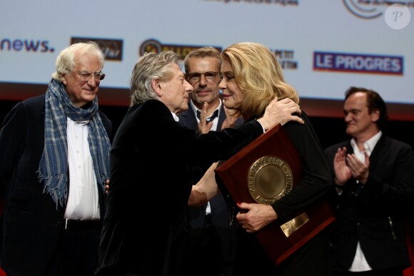 Roman Polanski, Bertrand Tavernier, Lambert Wilson et Catherine Deneuve lors de la remise du Prix Lumière 2016 à Catherine Deneuve durant le 8ème Festival Lumière à Lyon, le 14 octobre 2016