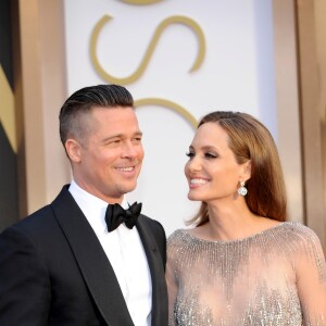 Brad Pitt et Angelina Jolie - Pressroom - 86e cérémonie des Oscars à Hollywood, le 2 mars 2014.