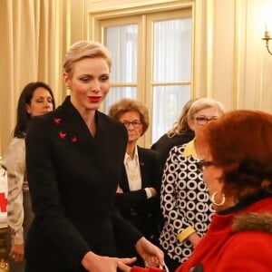 Exclusif - Le prince Albert II de Monaco et la princesse Charlene participent à la remise des cadeaux aux anciens monégasques dans les locaux de la Croix Rouge à Monaco le 16 décembre 2016.