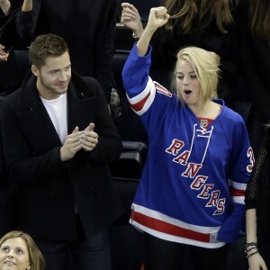 Margot Robbie et Tom Ackerley au Madison Square Garden à New York le 26 février 2015.