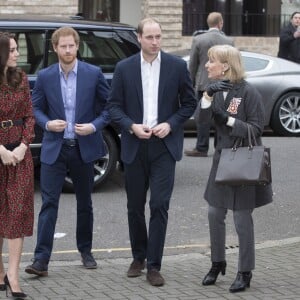 La duchesse Catherine de Cambridge, le prince William et le prince Harry prenaient part le 19 décembre 2016 à l'assemblée générale et la fête de Noël de leur association Heads Together, à Londres.