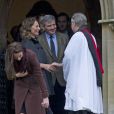 La duchesse Catherine de Cambridge quitte avec sa fille la princesse Charlotte l'église d'Englefield après la messe de Noël le 25 décembre 2016, suivie de ses parents Carole et Michael Middleton.