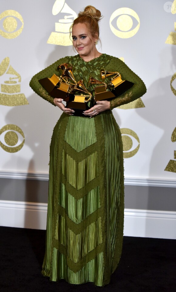 Singer Adele appears backstage with her awards for Album Of The Year and Best Pop Vocal Album for "25"and Song Of The Year, Record Of The Year and Best Pop Solo Performance for "Hello" during the 59th annual Grammy Awards held at Staples Center in Los Angeles, CA, USA, on February 12, 2017. Photo by Christine Chew/UPI/ABACAPRESS.COM13/02/2017 - Los Angeles