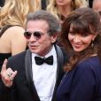 Philippe Manoeuvre et sa femme Candice de la Richardière (bijoux Van Cleef &amp; Arpels) - Montée des marches du film "Mad Max : Fury Road" lors du 68e Festival International du Film de Cannes, le 14 mai 2015.