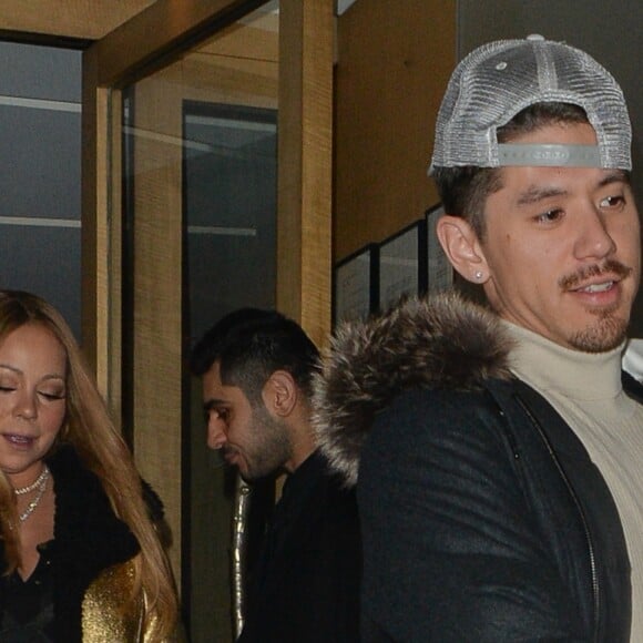 Exclusif - Prix Spécial - Mariah Carey, sa fille Monroe dans les bras du nouveau compagnon de Mariah, Bryan Tanaka à la sortie du restaurant japonais Nobu à Londres, Royaume Uni, le 15 janvier 2017. © CPA/Bestimage - Merci de flouter le visage de l'enfant avant publication -  Exclsuive - Mariah Carey and boyfriend Bryan Tanaka seen leaving Nobu Mayfair with Mariah's daughter Monroe in the arms of Bryan in London, UK on Sunday January 15, 2017.15/01/2017 - Londres