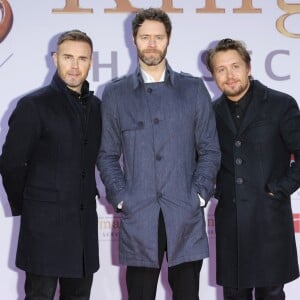 Gary Barlow, Howard Donald et Mark Owen du groupe "Take That" à la Première du film "Kingsman : Services secrets" à Berlin. Le 3 février 2015