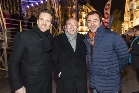 Julien Fregonara, directeur de MFM Radio, Gérard Collomb, maire de Lyon et Bernard Montiel lors du concert MFM Radio Live, place de la République à Lyon, le 3 mars 2017.