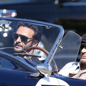 Johnny Hallyday accompagné de Maxim Nucci (Yodelice), arrive au restaurant "Soho House" à Malibu, au volant de son cabriolet AC Cobra marqué de son chiffre porte-bonheur, le numéro 7. Laeticia Hallyday, toujours en béquilles, les rejoint dans une autre voiture. Malibu, le 09 mars 2017.