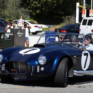 Johnny Hallyday accompagné de Maxim Nucci (Yodelice), arrive au restaurant "Soho House" à Malibu, au volant de son cabriolet AC Cobra marqué de son chiffre porte-bonheur, le numéro 7. Laeticia Hallyday, toujours en béquilles, les rejoint dans une autre voiture. Malibu, le 09 mars 2017.