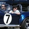 Johnny Hallyday accompagné de Maxim Nucci (Yodelice), arrive au restaurant "Soho House" à Malibu, au volant de son cabriolet AC Cobra, le 9 mars 2017.