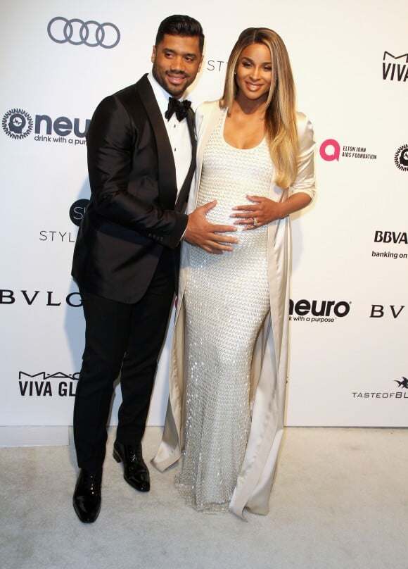 Ciara, enceinte et son mari Russell Wilson à la soirée Elton John AIDS foundation 2016 à West Hollywood le 26 février 2017.