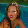 Kim des Marseillais sexy dans sa piscine, le 25 juillet 2016.