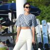 Exclusive - Kendall Jenner à Juan-les-Pins, près de Cannes, porte un top et un pantalon Solace, et des sandales Prada. Des lunettes de soleil Le Specs x Adam Selman et un sac Saint Laurent accessoirisent sa tenue. Le 23 mai 2017.
