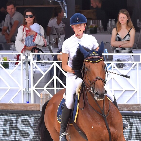 Matilde Borromeo monte sous le regard de la princesse Caroline de Hanovre, qui porte son petit-fils Stefano Casiraghi, d'Alexandra de Hanovre et de Beatrice Borromeo, mère de Stefano lors du Jumping international de Monte-Carlo, étape du Longines Global Champions Tour, le 23 juin 2017 à Monaco. © Bruno Bebert / Bestimage