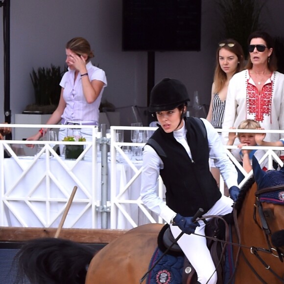 Charlotte Casiraghi passe devant la princesse Caroline de Hanovre, la princesse Alexandra de Hanovre, le prince Karl-Egon von Fürstenberg et le prince Alexander von Fürstenberg lors du Jumping international de Monte-Carlo, étape du Longines Global Champions Tour, le 23 juin 2017 à Monaco. © Bruno Bebert / Bestimage