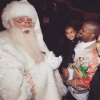 Kim Kardashian, son mari Kanye West et leur fille North West rencontrent le Père Noël. Décembre 2015.