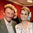 Johnny et Laeticia Hallyday - Vente aux enchères des Poupées frimousse à l'hôtel Drouot, à Paris, au profit de l'Unicef, le 24 novembre 2005.