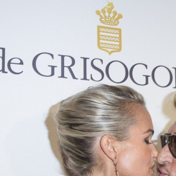 Johnny et Laeticia Hallyday - Inauguration du Show Room Parisien De Grisogono et lancement de la montre "Crazy Skull" à Paris le 23 octobre 2014.