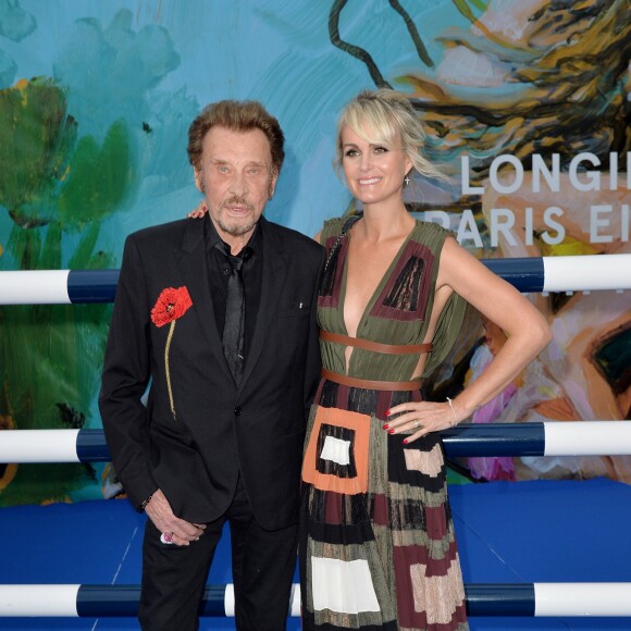 Exclusif - Johnny Hallyday et sa femme Laeticia Hallyday - Soirée au profit de l'Association "La Bonne étoile" de Laeticia Hallyday lors du 3ème Longines Paris Eiffel Jumping à la plaine de Jeux de Bagatelle à Paris le 1er juillet 2016 dans le Pavillon Eiffel du Longines Paris Eiffel Jumping décoré par Luxury Living. © Olivier Borde / Veeren / Bestimage