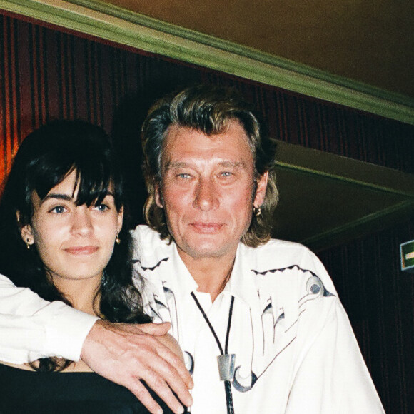 Johnny Hallyday fête son 48ème anniversaire avec Adeline au restaurant Doyen à Paris le 15 juin 1991. © Patrick Carpentier / Bestimage