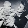 Johnny Hallyday (Jean-Philippe Smet) bébé, dans les bras de sa maman Huguette. Photo exposée dans le documentaire "La story de Johnny Hallyday, de l'idole à la légende", diffusé sur C8 le 6 décembre 2017.