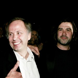 Johnny Hallyday et Fabrice Luchini avec Laurent Tuel, le réalisateur de Jean-Philippe, à Paris en mars 2006.