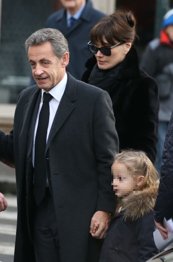 Carla Bruni et Nicolas Sarkozy avec leur fille Giulia aux obsèques d'Andrée Sarkozy, dite Dadue et née Andrée Mallah, en l'église Saint-Jean-Baptiste à Neuilly-Sur-Seine. Le 18 décembre 2017 