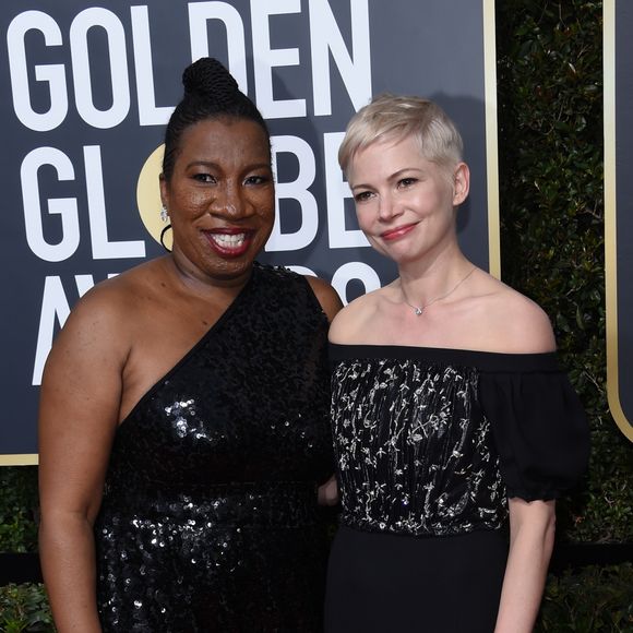 Michelle Williams et l'activiste Tarana Burke sur le tapis rouge de la 75ème cérémonie des Golden Globe Awards au Beverly Hilton à Los Angeles, le 7 janvier 2018.