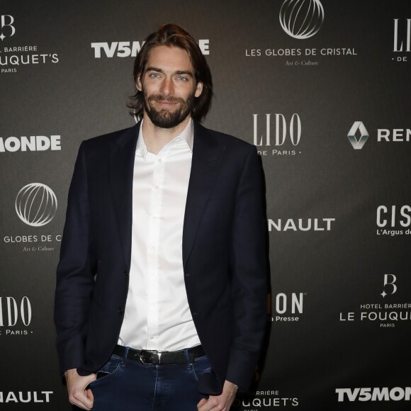 Camille Lacourt - Photocall - 12ème cérémonie des Globes de Cristal au Lido à Paris, le 12 février 2018. © Rachid Bellak / Pool / Bestimage