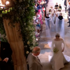 Meghan Markle est apparue dans sa robe de mariée signée Clare Waight Keller pour Givenchy, dont la traîne est portée par les enfants d'honneur, le 19 mai 2018 à Windsor pour son mariage avec le prince Harry.