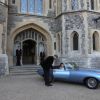 Le prince Harry, duc de Sussex, et Meghan Markle, duchesse de Sussex, habillée d'une robe Stella McCartney et portant une bague sertie d'une aigue-marine ayant appartenu à Lady Diana, ont quitté le château de Windsor après la réception offerte par Elizabeth II pour rejoindre à bord d'une Jaguar E-Type Concept Zero immatriculée "190518" Frogmore House où avait lieu la réception de leur mariage, le 19 mai 2018.