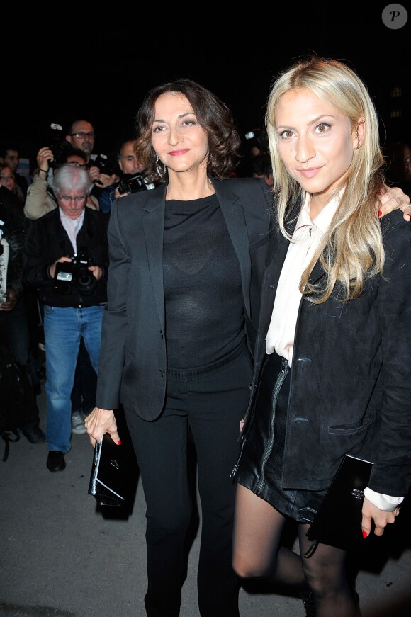 Nathalie Rykiel et sa fille Lola au defilé de mode "Yves Saint Laurent", collection pret-a-porter printemps-été 2014, au Grand Palais à Paris le 30 septembre 2013