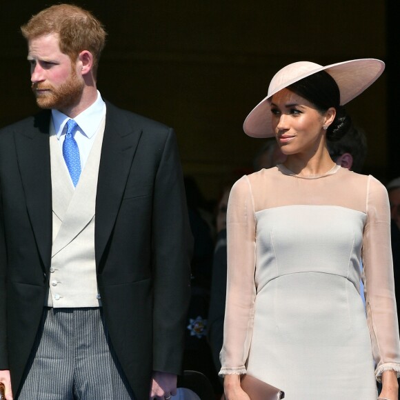 Le prince Harry, duc de Sussex, et Meghan Markle, duchesse de Sussex, lors de la garden party pour les 70 ans du prince Charles au palais de Buckingham à Londres. Le 22 mai 2018