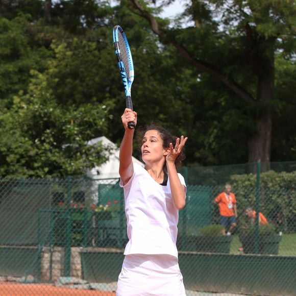 Exclusif - Clemence Castel - 26ème édition du Trophée des personnalités en marge des Internationaux de Tennis de Roland Garros à Paris, Frnce, le 8 juin 2018. La 26ème édition du trophée des personnalités rassemblera de nombreuses célébrités qui viendront partager un moment convivial et solidaire autour de leur passion pour le tennis. Cette année, le trophée innove en invitant les personnalités à venir mesurer leur vitesse de balle pour la bonne cause. Pour la première fois, grâce au soutien de Engie et Babolat, chaque kilomètre heure sera converti en euro. 1 km/h = 1 euro. Le montant additionné sera remis par les vainqueurs aux associations "Premier de Cordée" et "Sourire à la vie". De plus, Engie remettra chaque jour un chèque à une association qui oeuvre pour l'accès au sport : "Princesse Margot" parrainée par K.Adams, "Innocence en danger" représentée par N.Baye, "Autour des williams" soutenue par O.Meunier et "Autiste sans frontières" avec L.Delahousse. © Denis Guignebourg/Bestimage  ( No Web No Blog pour la Belgique et la Suisse)08/06/2018 - Paris